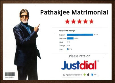 Certificate display showing Pathakjee Matrimonial rated on Justdial with Amitabh Bachchan image pointing on it inside a dark wood frame